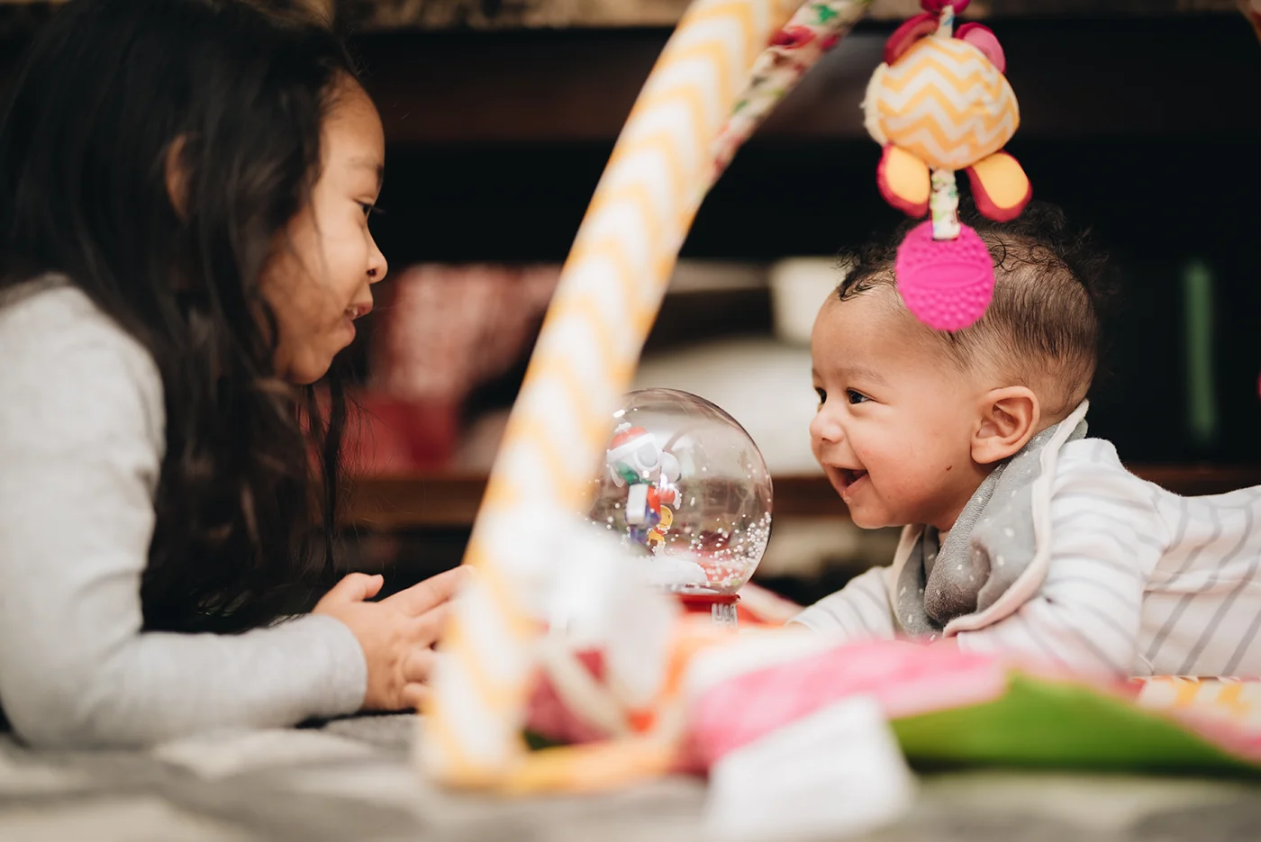 sibling helping baby learn to talk
