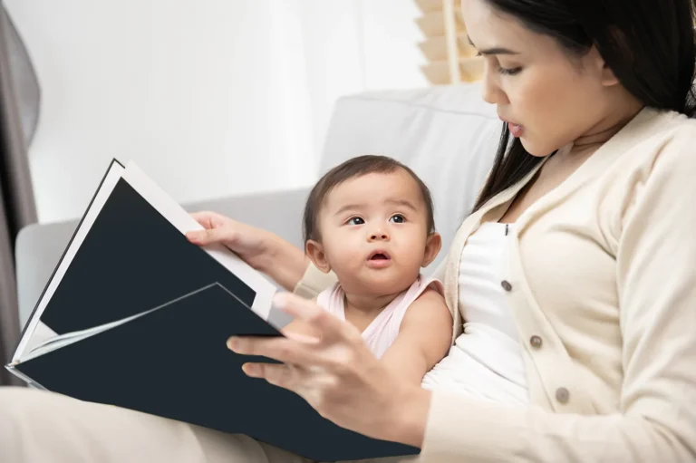 mom reading to baby