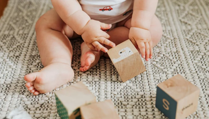 baby playing with blocks
